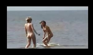 naked Beach - Two aroused
 teenagers
 Frolicking