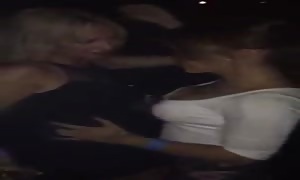 Spanish ladies kissing in club